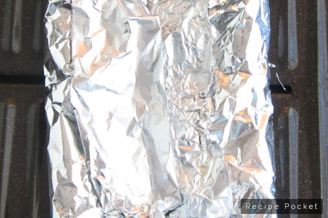 Roasted capsicum wrapped in foil.