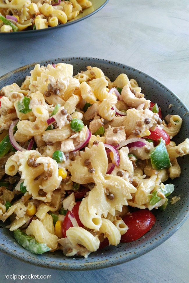 Cold chicken pasta with cheese, peas and corn.