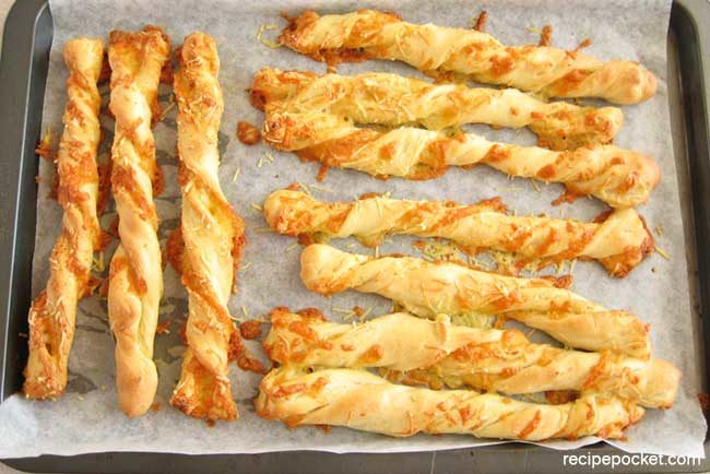 Baked homemade cheese bread sticks fresh from the oven.