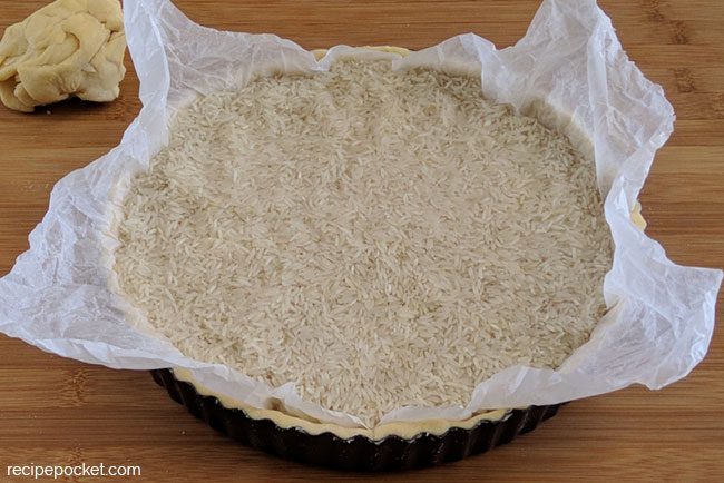 Image showing shortcrust pastry case filled with rice for blind baking.