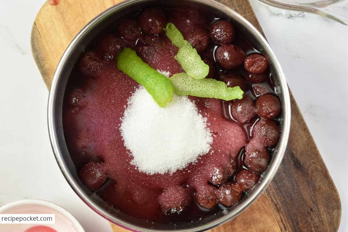 Image showing ingredients for cherry jam in pot before cooking.