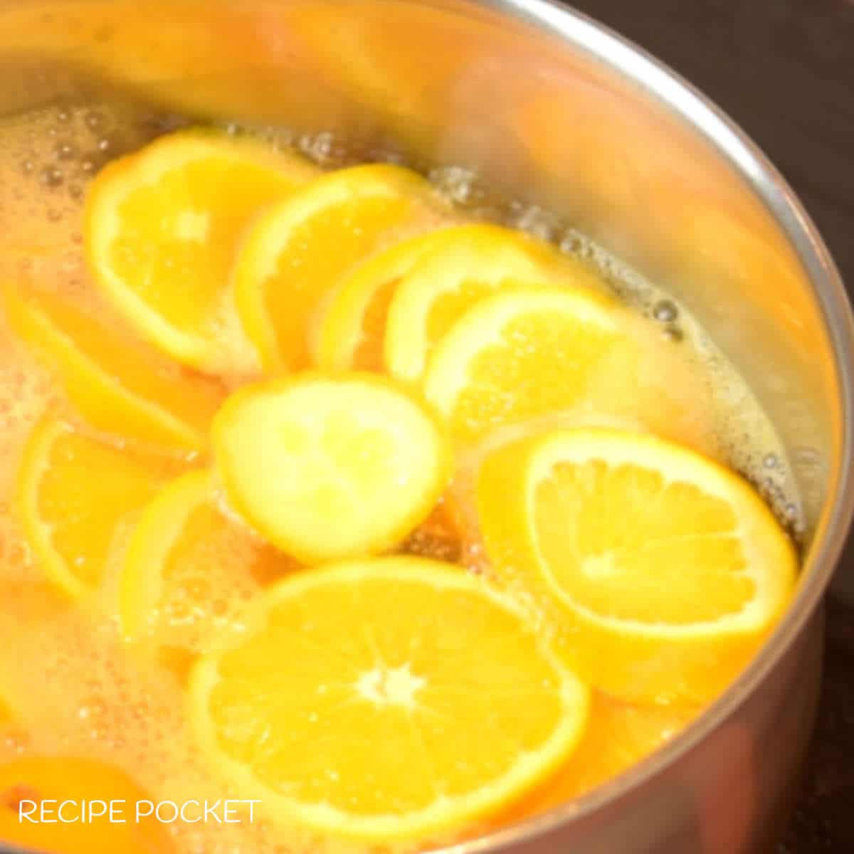 Orange slices ing boiling water.