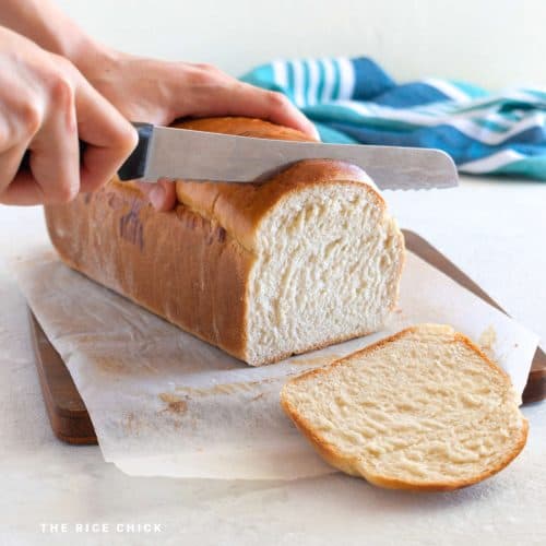 A loaf of mochi bread being sliced.