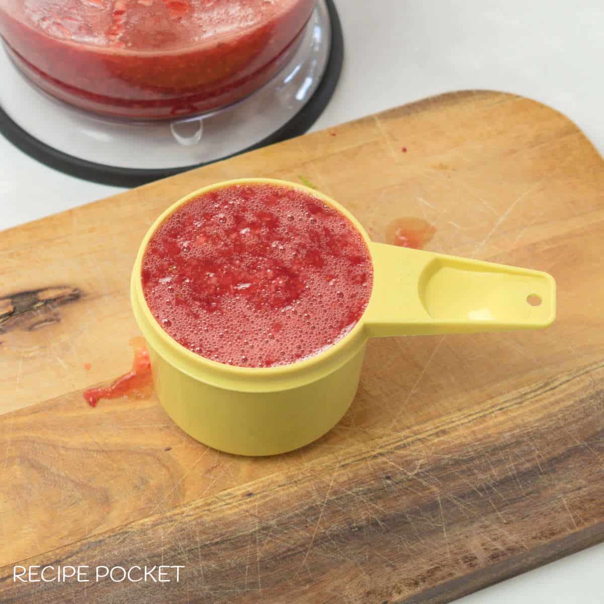 Strawberry puree in a cup.