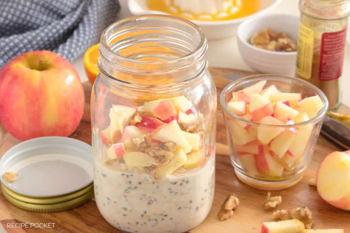 Overnight oats with apple topping in a screw top jar.