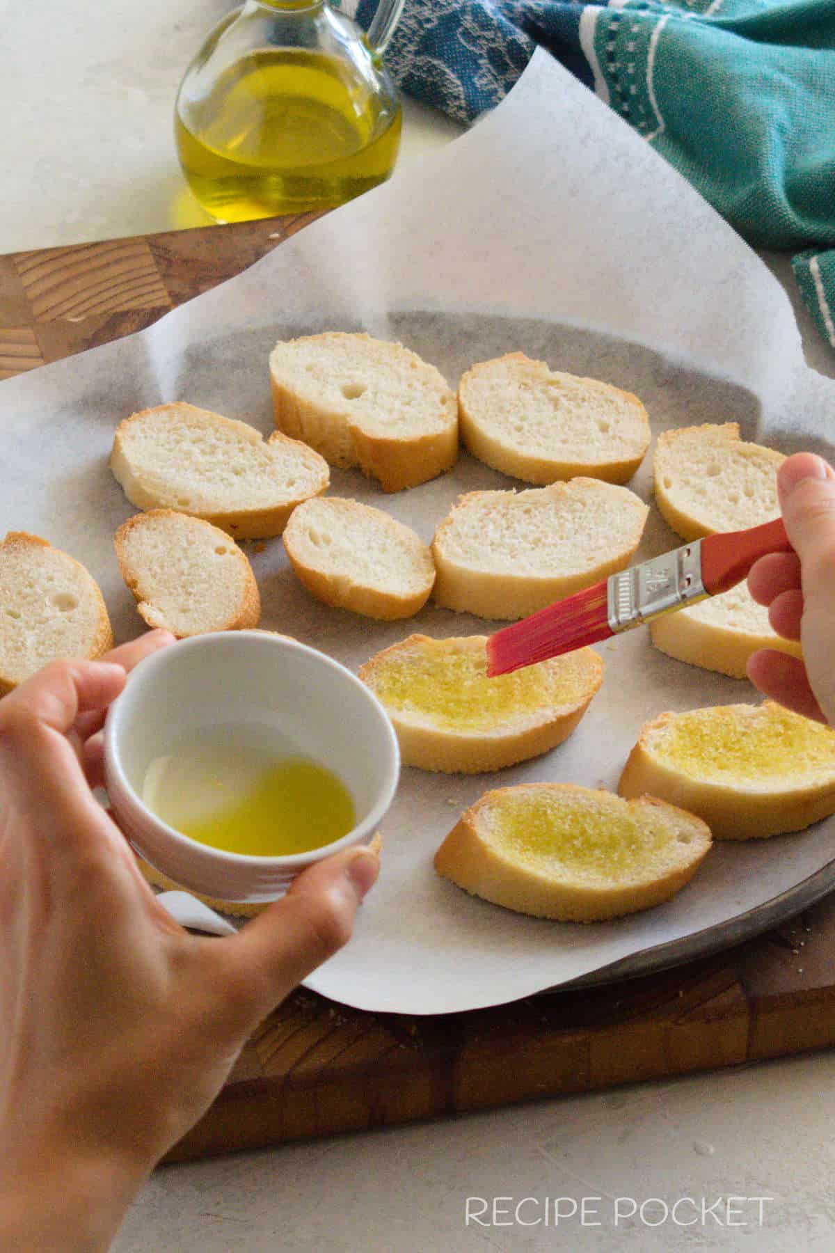 Baguette slices with olive oil.