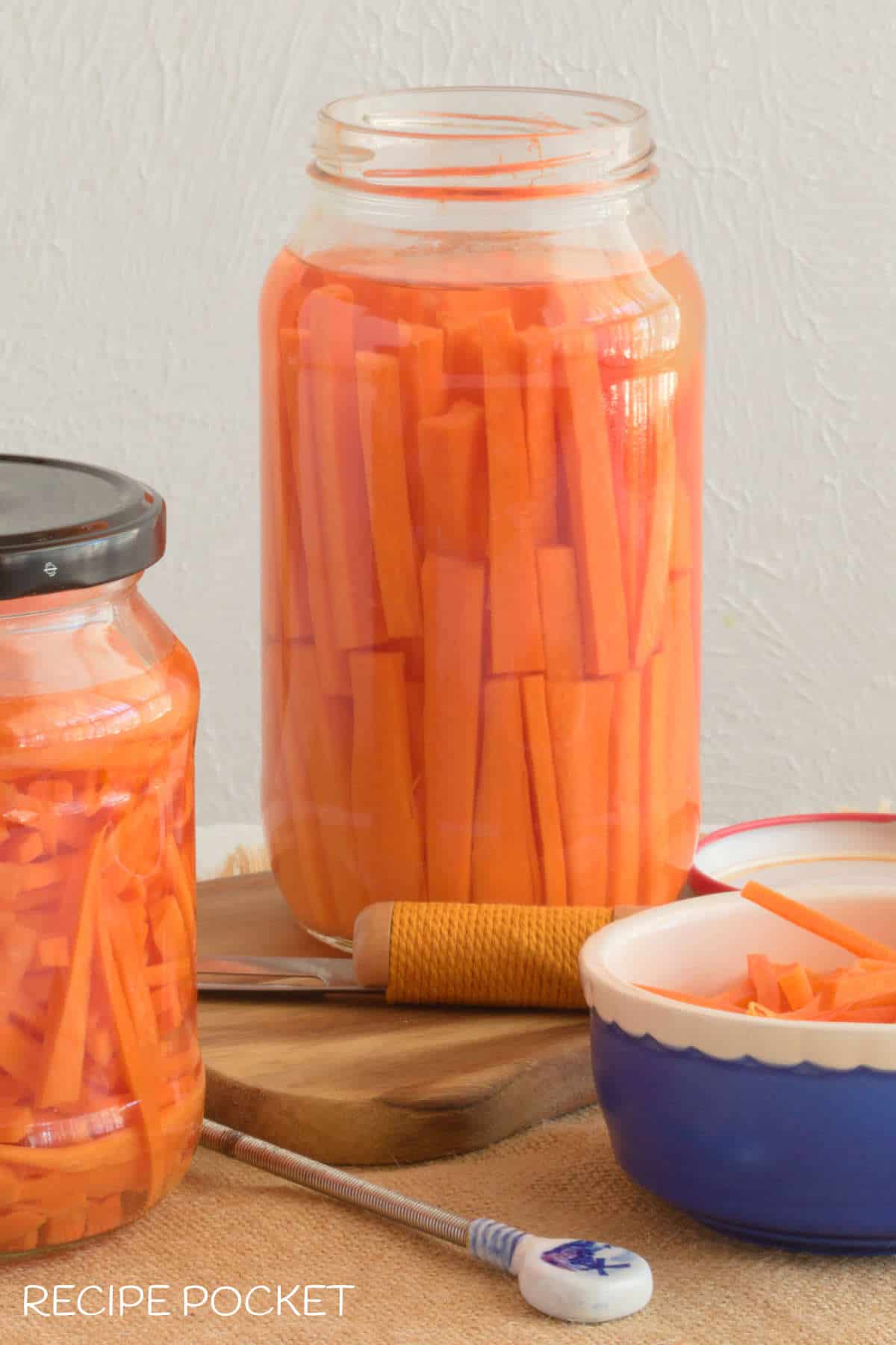 Carrot sticks in pickle jar.