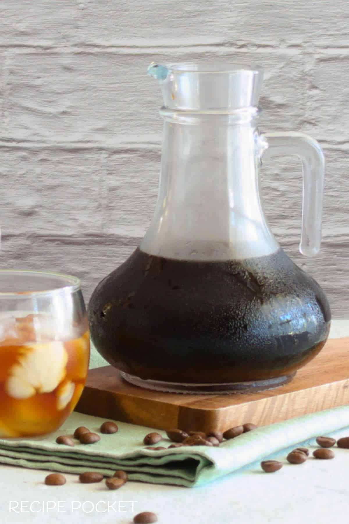 A close up of cold brew coffee in a jug.