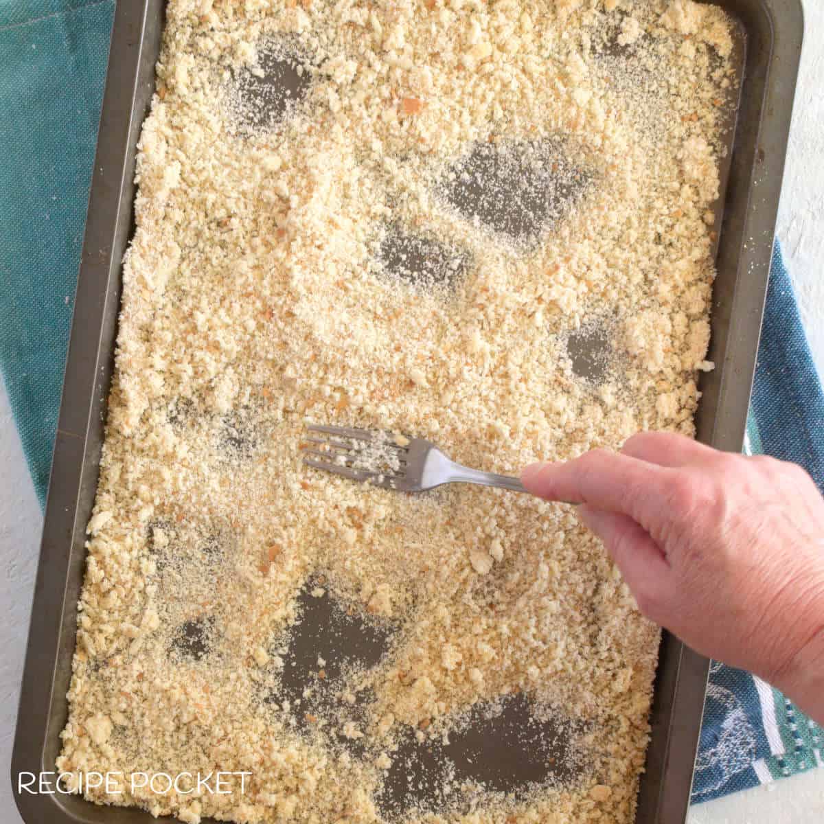 Baked bread crumbs on a tray.