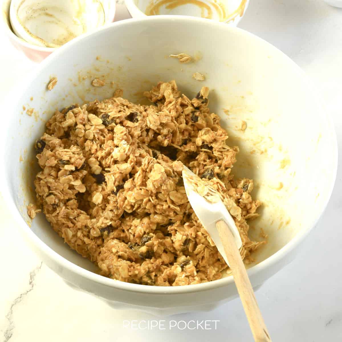 Peanut butter oatmeal ball mixture in a mixing bowl.