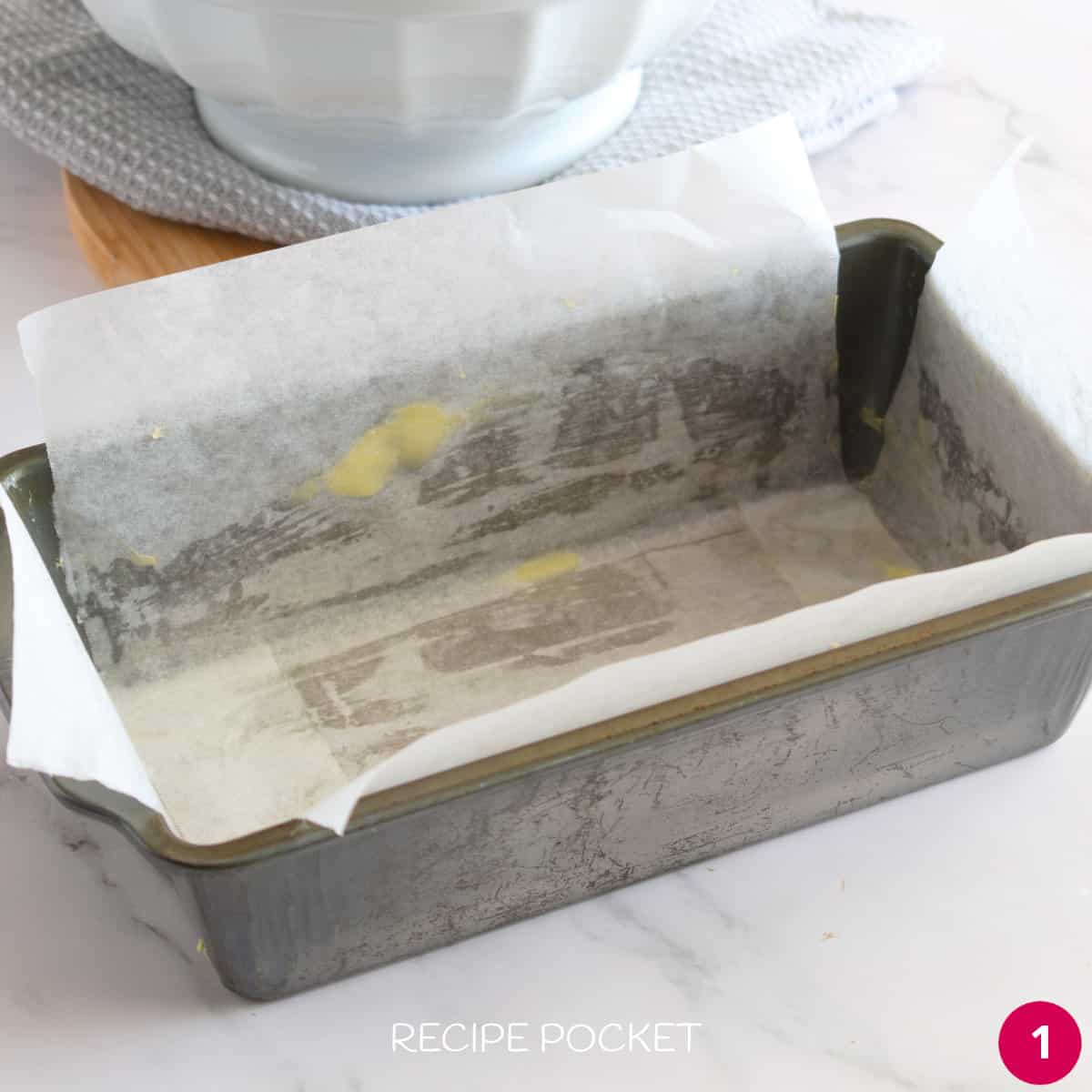A baking tin lined with baking paper.