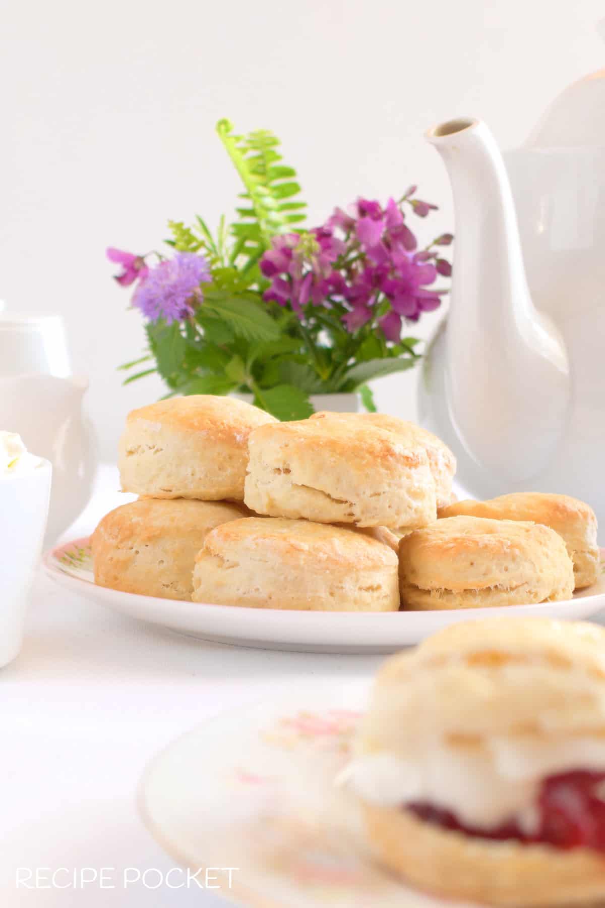 Scones and a table set for afternoon tea.