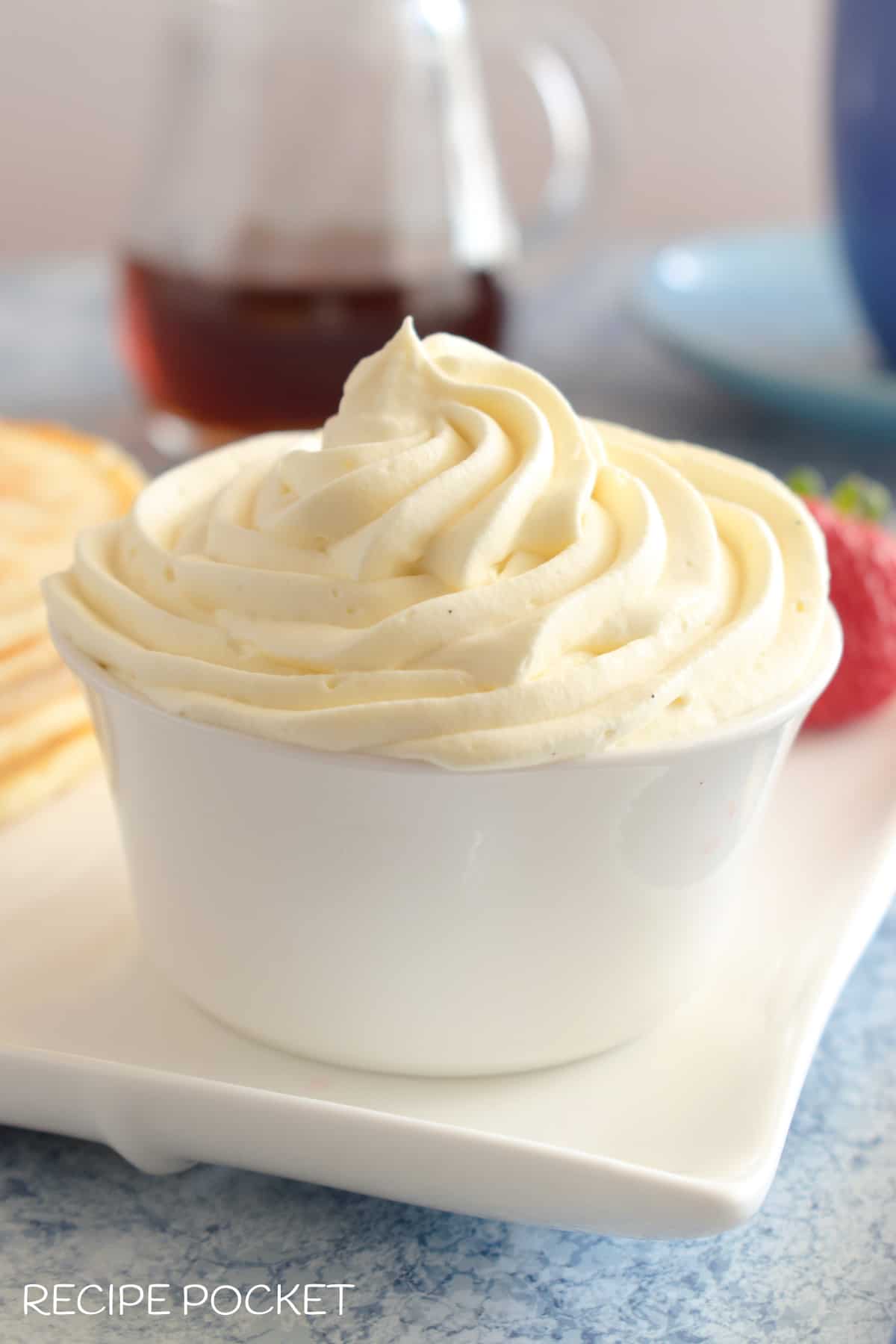 Maple whipped cream in a white bowl.