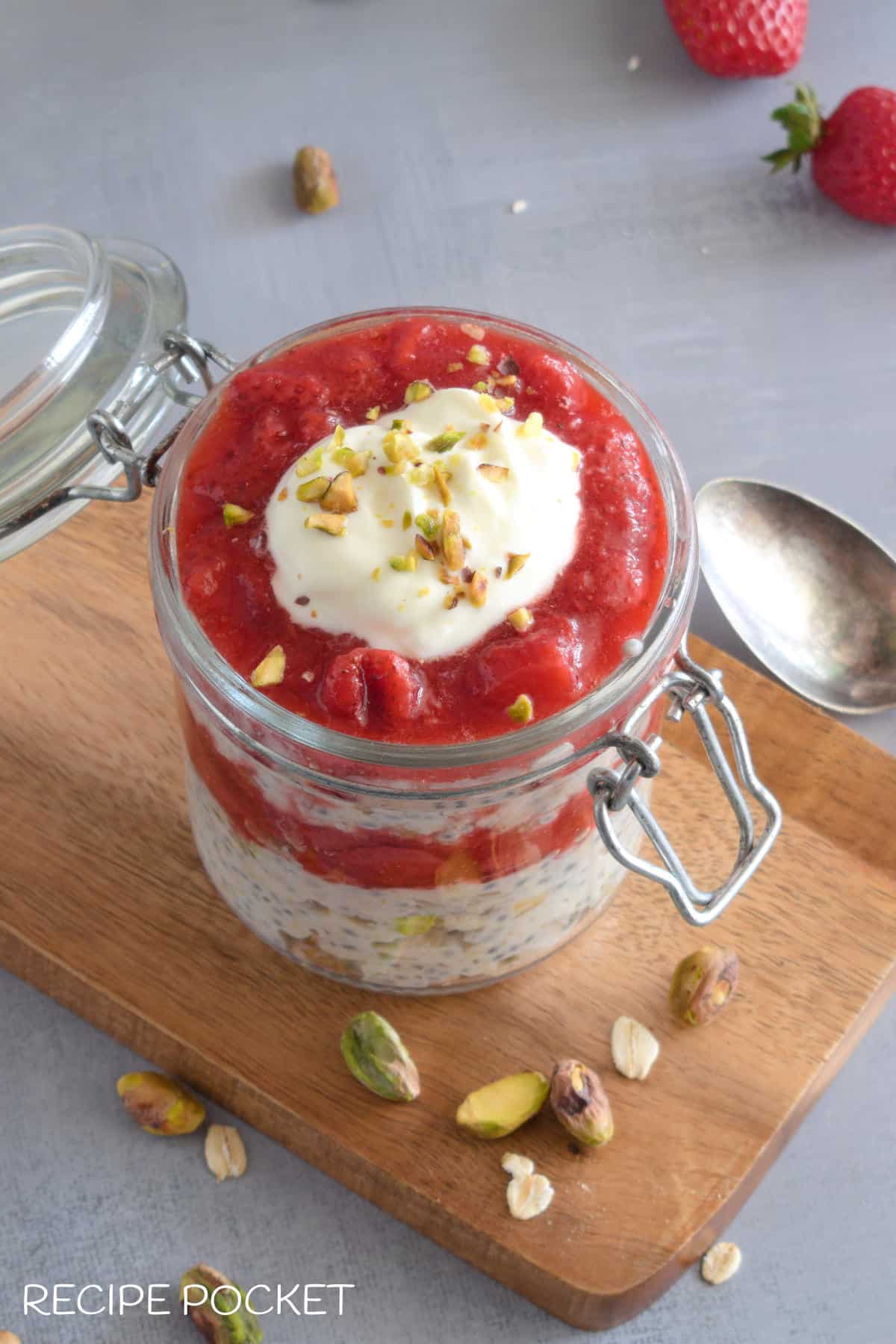 Images showing a strawberry sauce and yogurt topping on overnight oats in a jar.
