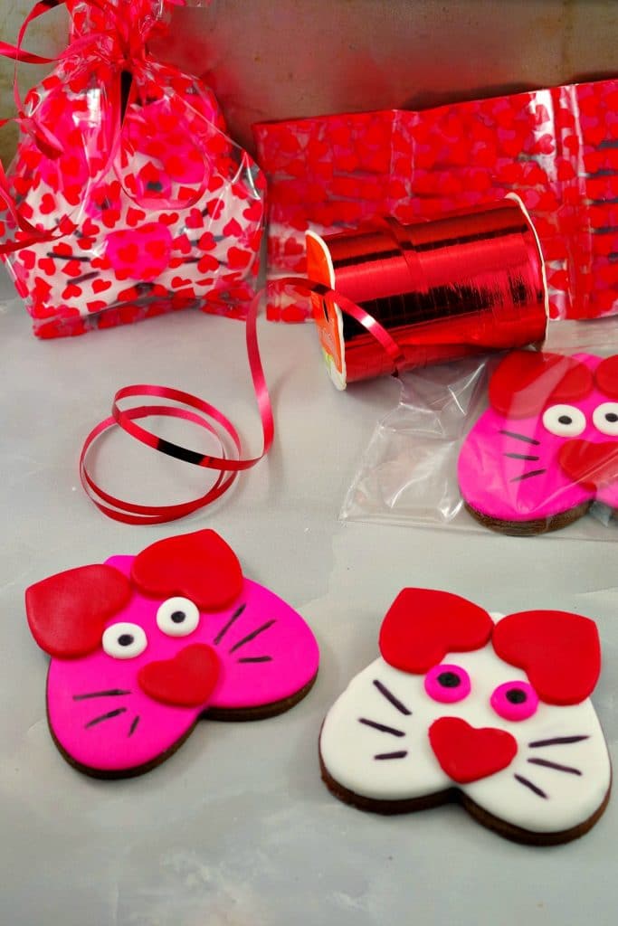 Cat cookies made with heart shaped cookies.