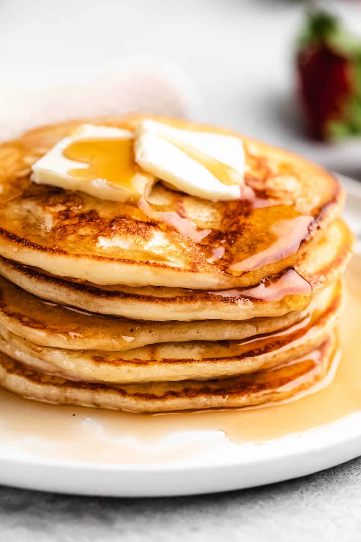 Pancakes with butter and syrup on top.