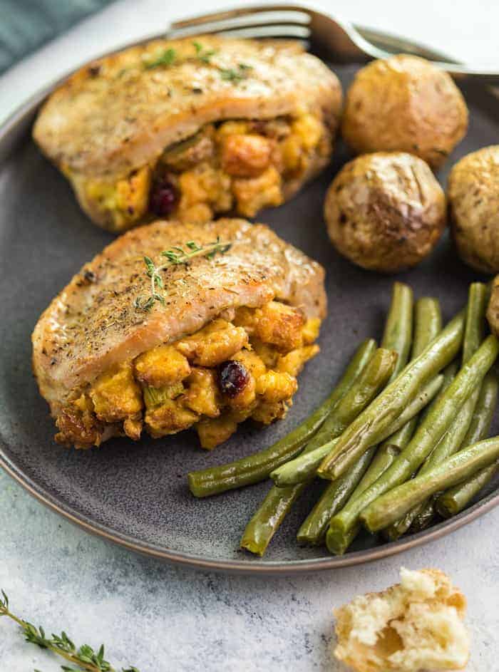 Stuffed pork chops with green beans and potatoes.