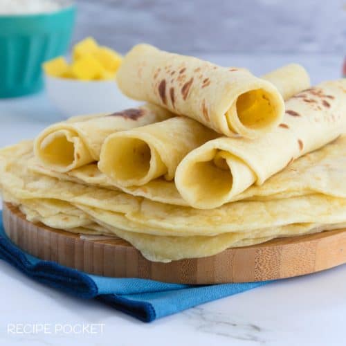 Closeup of tortillas rolled in to tubes.